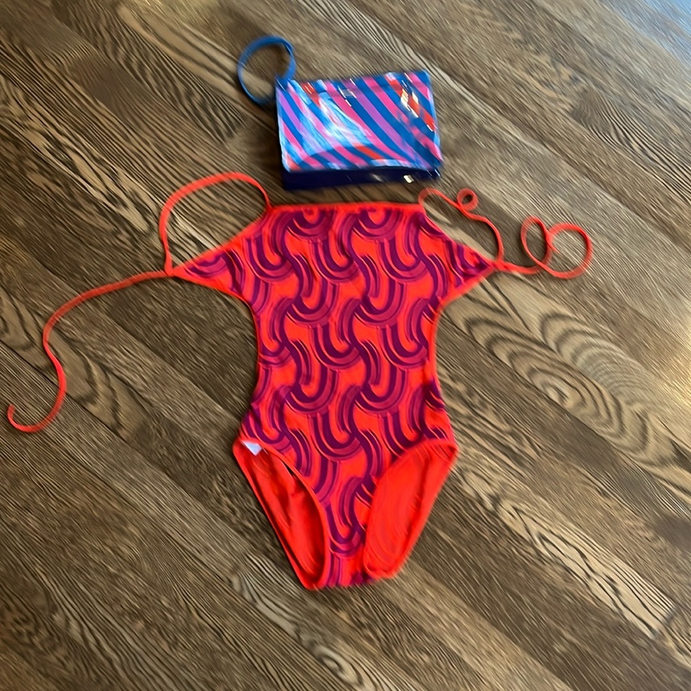 Like new one piece eres swim suit with clutch